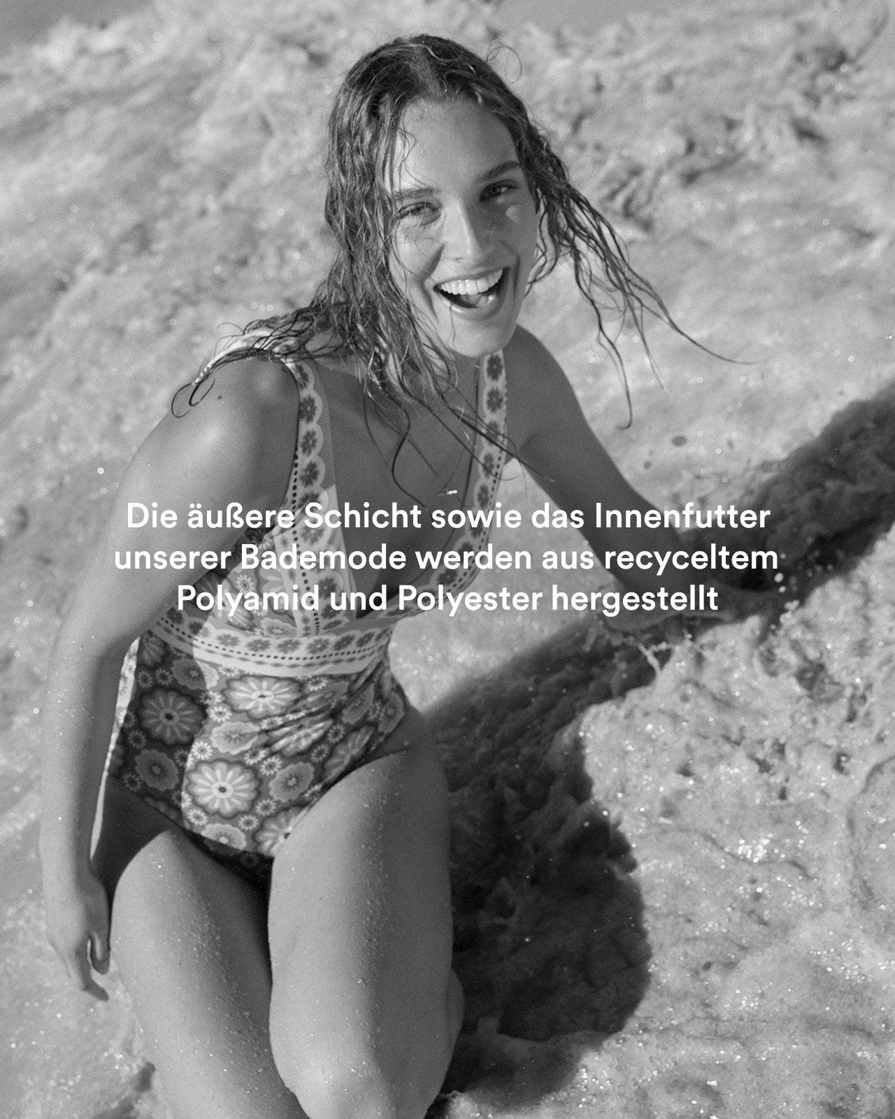 Woman on beach in Boden swimsuit