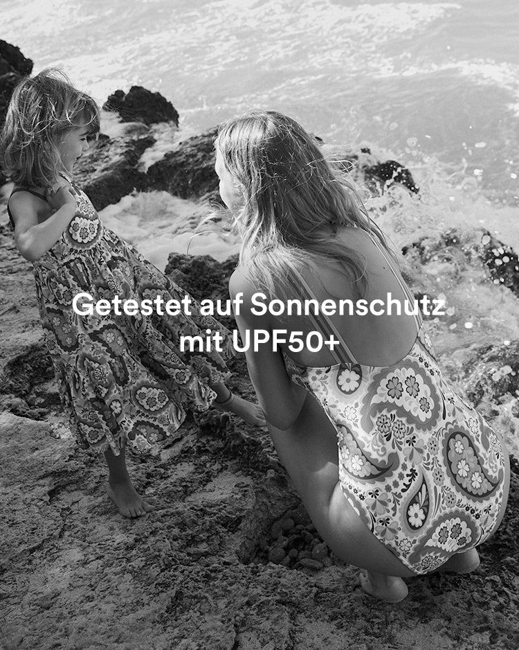 Woman and girl in Boden printed beachwear