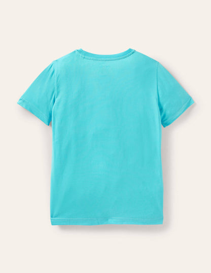 Strand-T-Shirt mit Applikation-Türkis, Surfender Hund