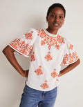 Top brodé à manches volantées-Ivoire, broderie pétard