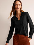 Pull à col volanté et noué-Noir