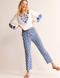 Knitterhose mit spitz zulaufendem Bein-Surf The Web und Naturweiß, Muscheln