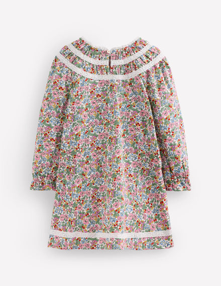 Jolie robe en jersey à détails en dentelle-Motif floral baies ivoire doux