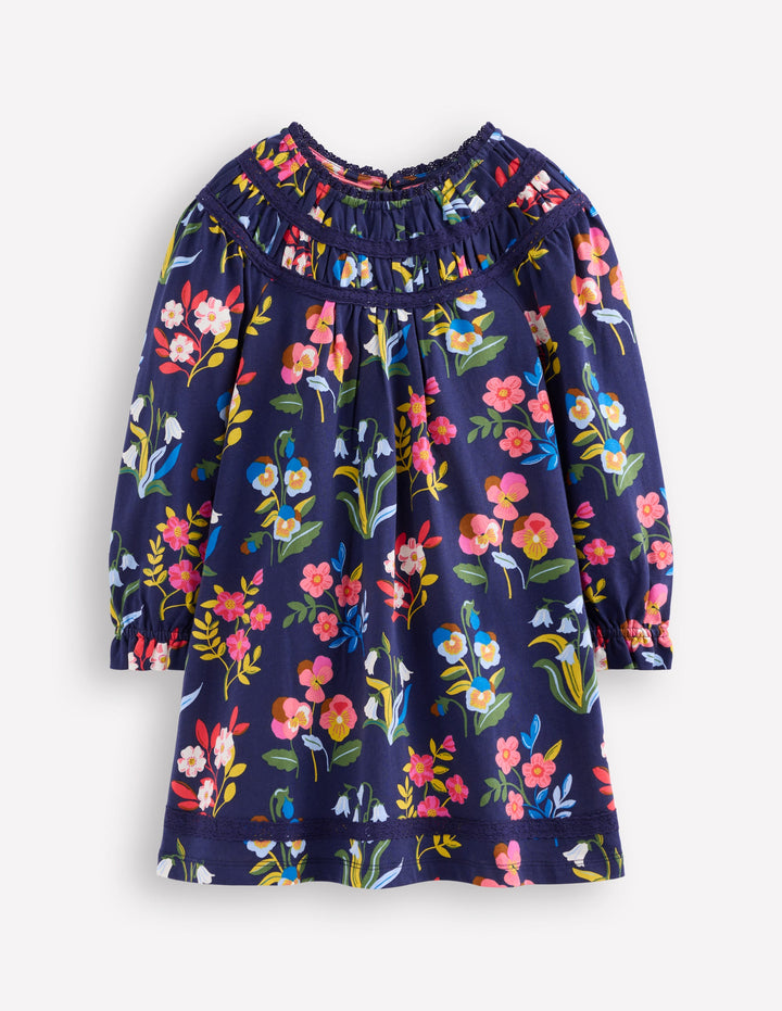 Hübsches Jerseykleid mit Spitzenbesatz-Schuluniform-Marineblau Stiefmütterchen-Beet