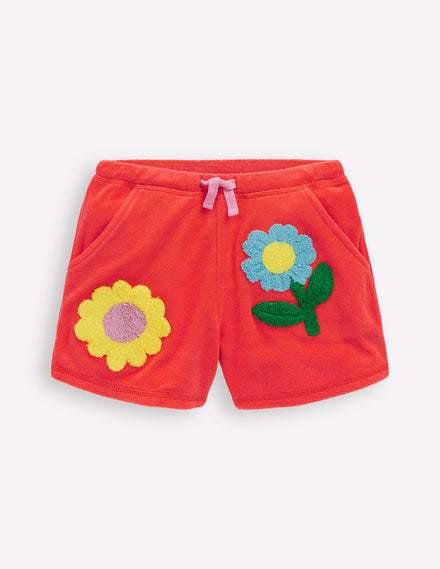 Gemusterte Frottee-Shorts-Korallenorange Blumen