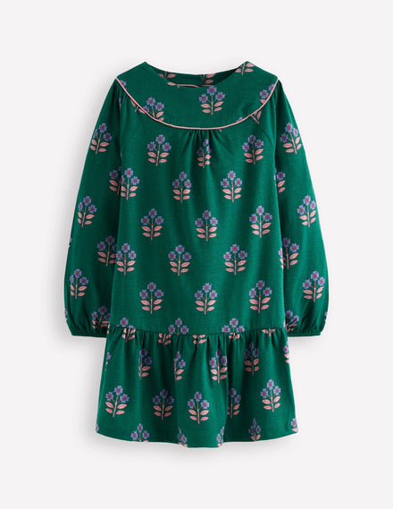 Jerseykleid mit geschwungener Passe-Juwelengrün Blumenstempel