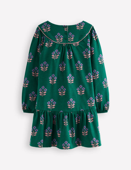 Jerseykleid mit geschwungener Passe-Juwelengrün Blumenstempel