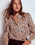 Top en velours côtelé à empiècement smocké-Motif floral ivoire