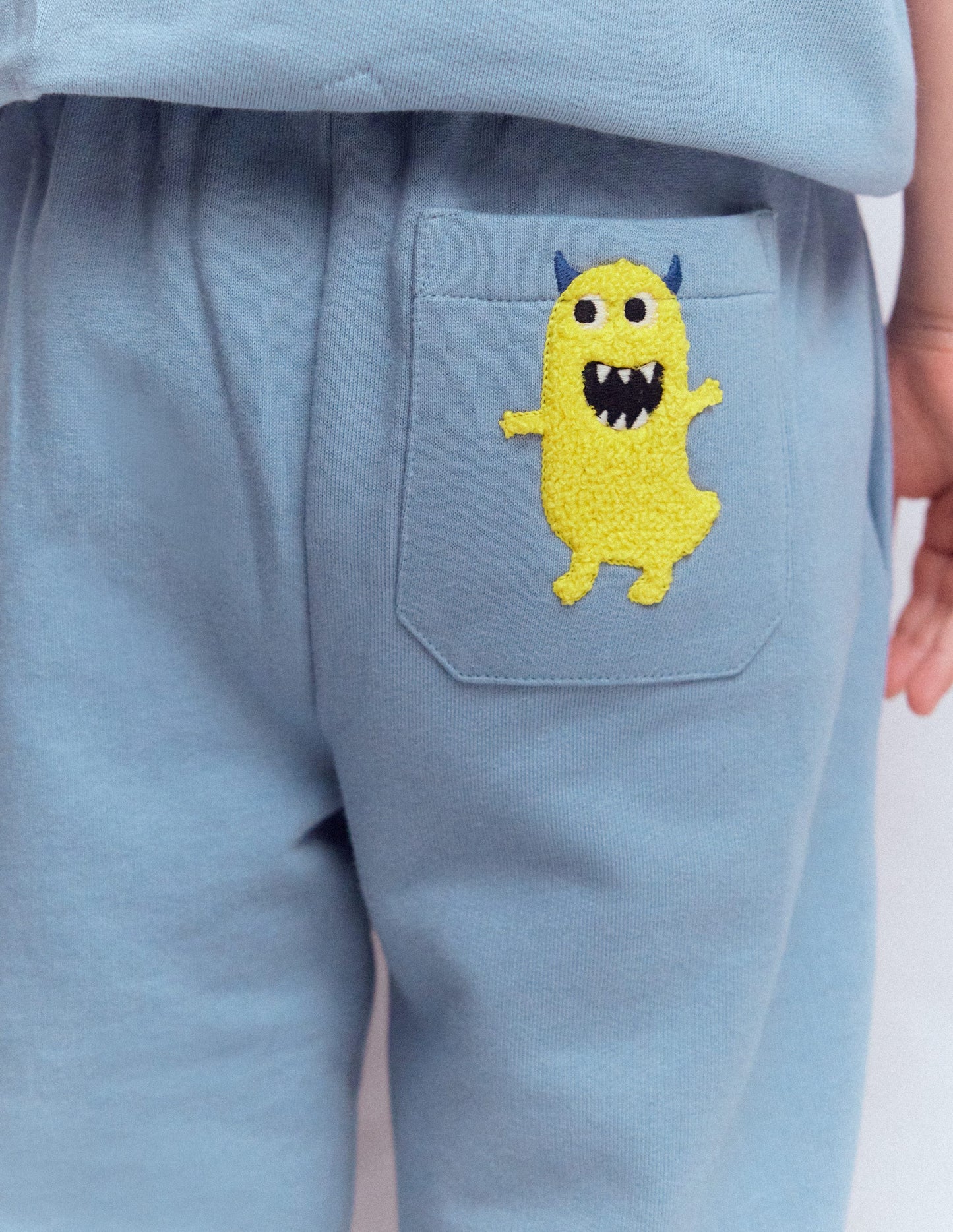 Bas de jogging fun-Appliqué monstre bleu français