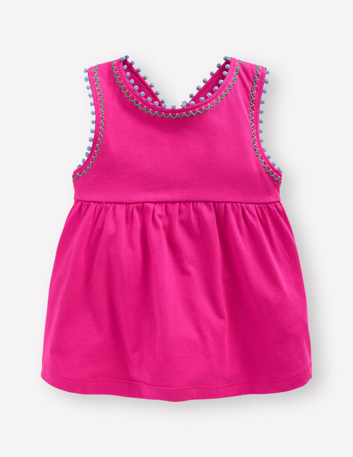 Oberteil mit überkreuzten Rückenträgern und Bommelbesatz-Rosarot