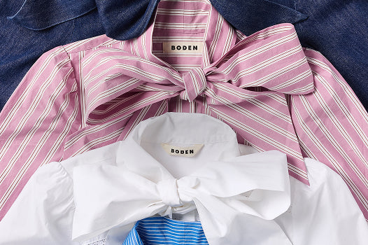 Collage aus Shirts mit großen Schleifen und dem „Boden“-Logo.