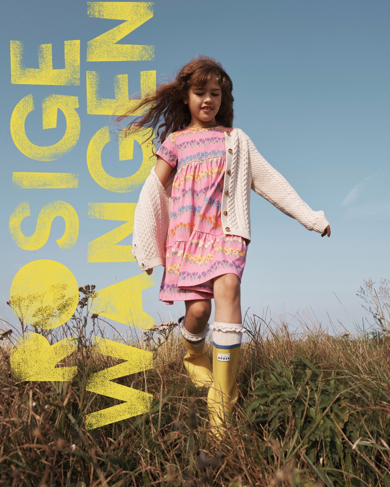 Rosige Wangen: Girl in a field wearing a pink Boden dress