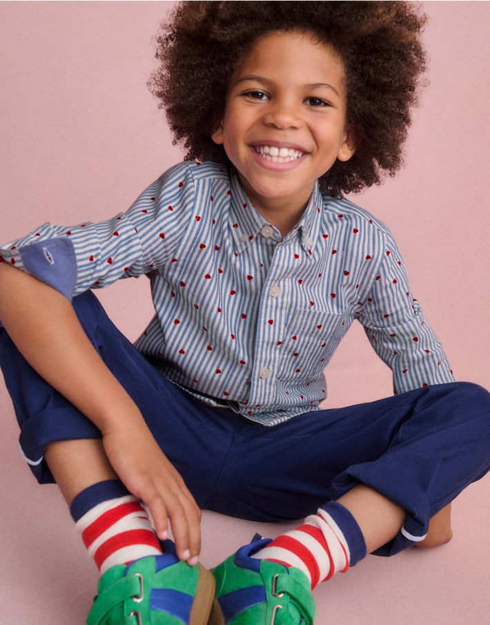Boy wearing Boden love heart shirt