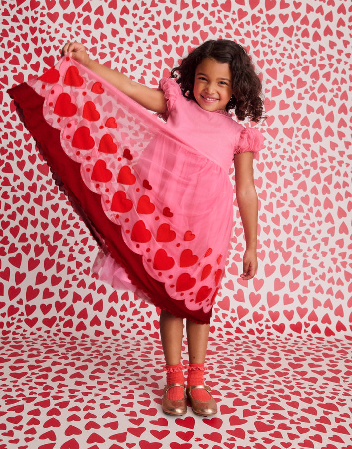Girl wearing love heart dress