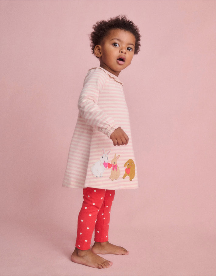 Baby girl wearing Boden bunny dress